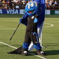 Football mascot shoved by player after pinning down pitch invader