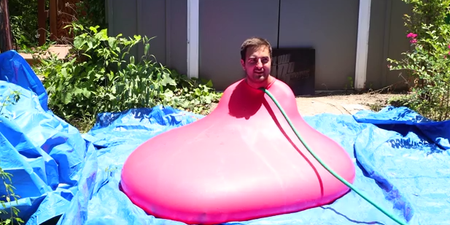 Awesome slow-mo video shows giant water balloon burst with man sat inside