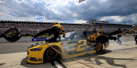 Watch as NASCAR driver crashes into his pit crew (Video)