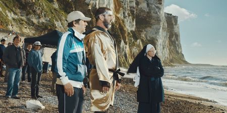 Eric Cantona swims the English channel in the stylish way only King Cantona can (Video)