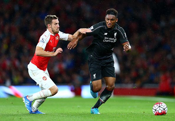 LONDON, ENGLAND - AUGUST 24: Joe Gomez of Liverpool takes on Aaron Ramsey of Arsenal during the Barclays Premier League match between Arsenal and Liverpool at the Emirates Stadium on August 24, 2015 in London, United Kingdom. (Photo by Clive Mason/Getty Images)