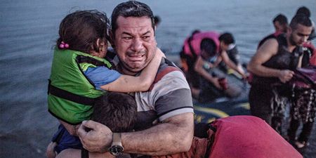 This iconic image of a Syrian man clinging to his family has a happy ending