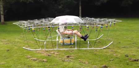 British eccentric invents flying machine made out of 54 drones (Video)