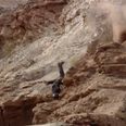 Not even falling off a cliff could stop this biker from completing an extreme course (Video)