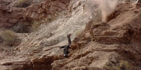 Not even falling off a cliff could stop this biker from completing an extreme course (Video)