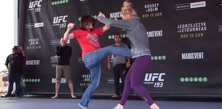 Watch Ronda Rousey opponent Holly Holm let a fan kick her in the gut