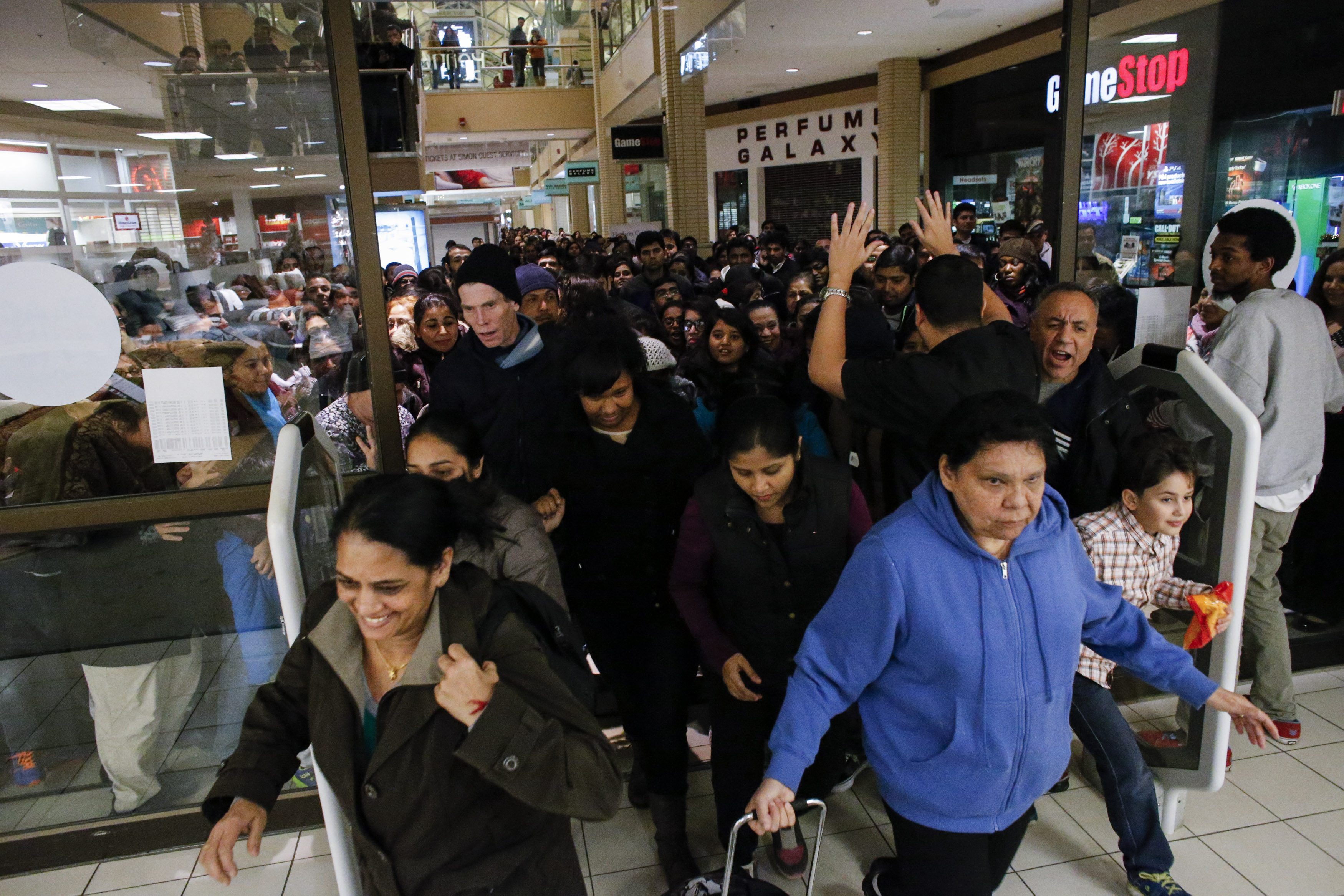 NEWPORT, NJ - NOVEMBER 27: People enter to JCpenny store on the Newport Mall on November 27, 2014 in Jersey City , New Jersey, United States. Black Friday sales, which now begin on the Thursday of Thanksgiving, continue to draw shoppers out for deals and sales. (Photo by Kena Betancur/Getty Images)