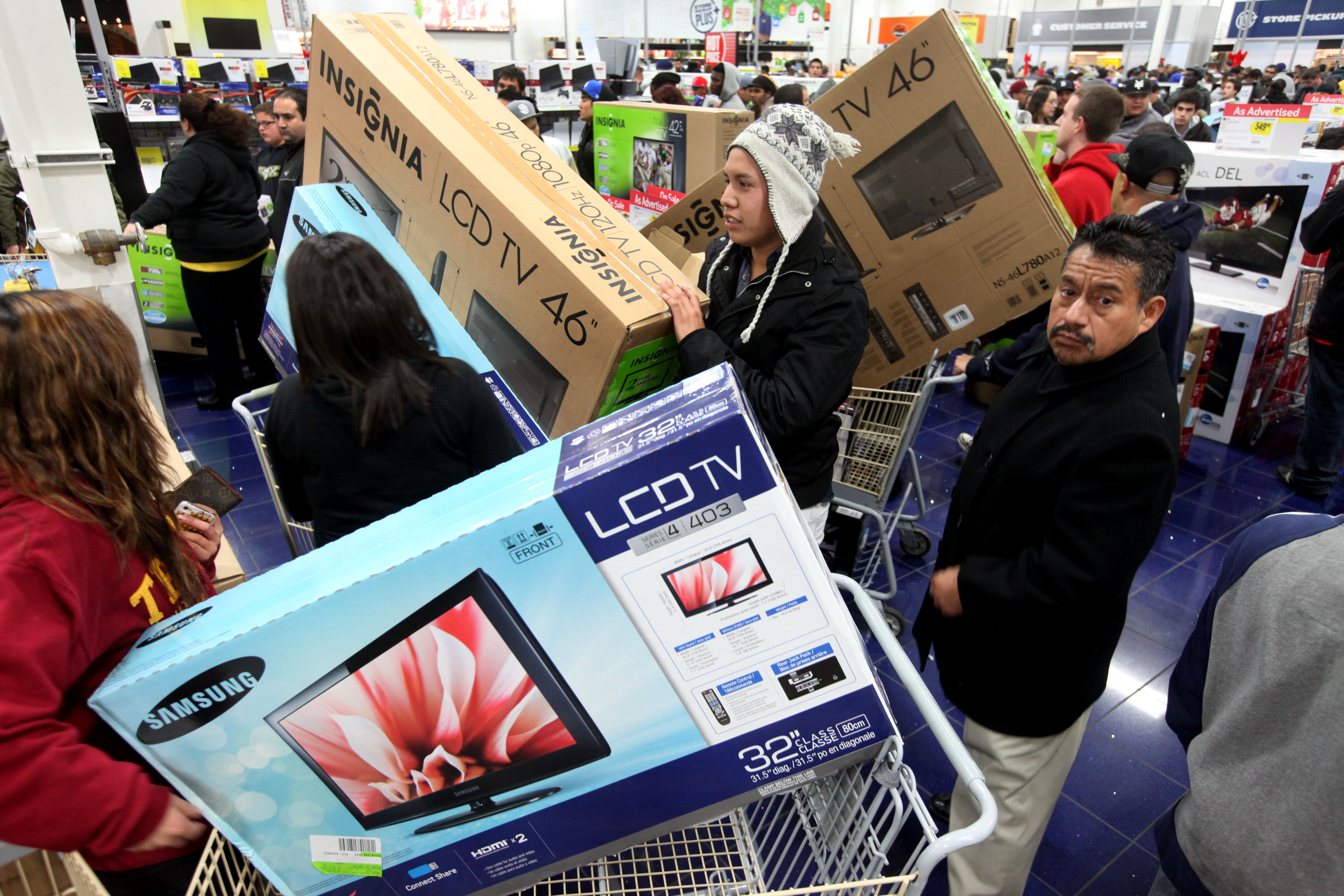 SAN DIEGO, CA - NOVEMBER 25: Customers shop for electronics items during 'Black Friday' at a Best Buy store on November 25, 2011 San Diego, California. Thousands of consumers are queuing at various stores across the nation to take advantage of 'Black Friday' deals as the holiday shopping season begins in America. (Photo by Sandy Huffaker/Getty Images)