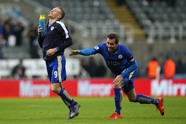 NEWCASTLE, ENGLAND - NOVEMBER 21: Christian Fuchs of Leicester City sends Jamie Vardy of Leicester City towards the fans during the Barclays Premier League match between Newcastle and Leicester City at St James Park on November 21, 2015 in Newcastle, England. (Photo by Ian MacNicol/Getty images)