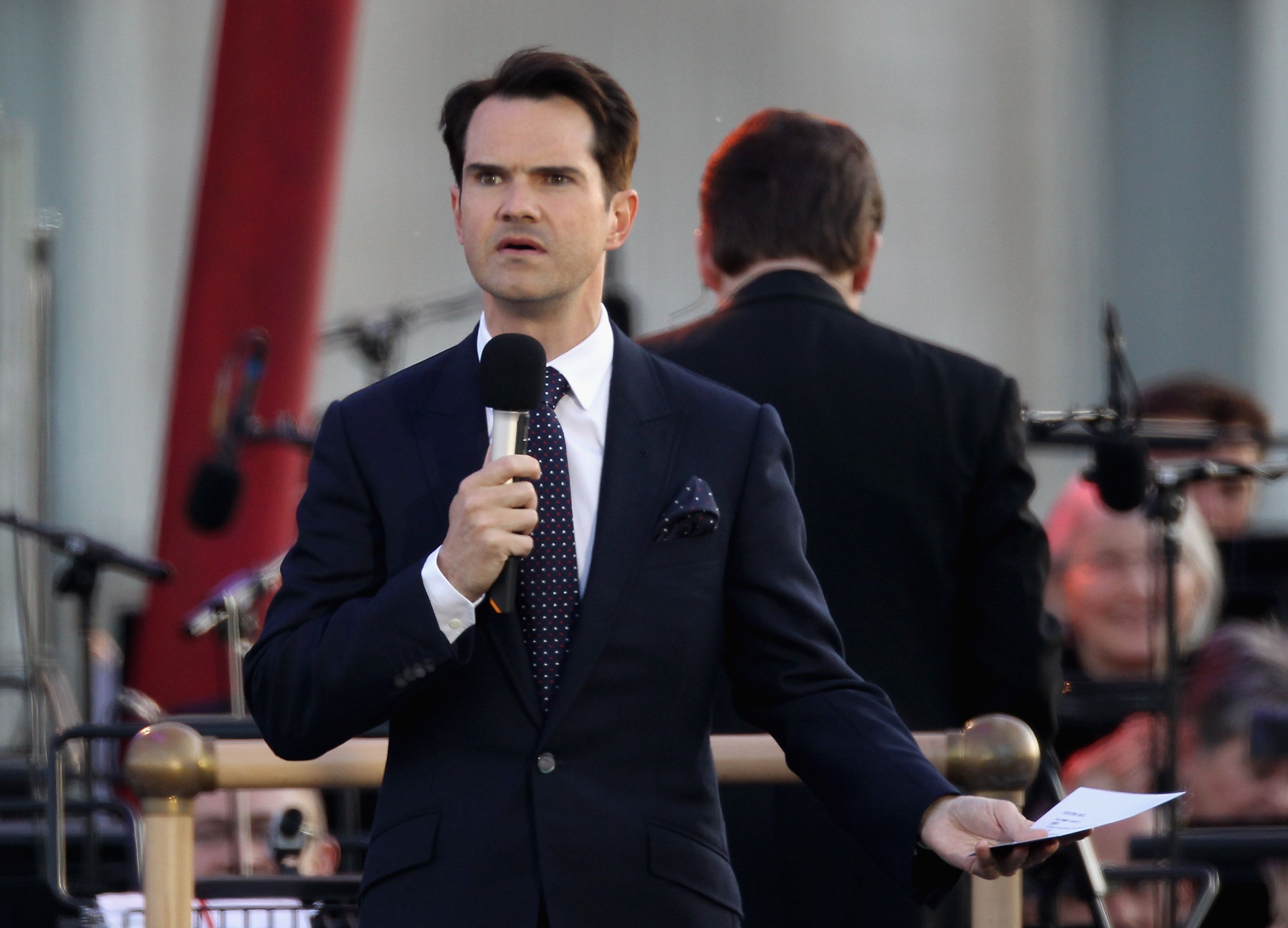 LONDON, ENGLAND - JUNE 04: Presenter Jimmy Carr on stage during the Diamond Jubilee concert at Buckingham Palace on June 4, 2012 in London, England. For only the second time in its history the UK celebrates the Diamond Jubilee of a monarch. Her Majesty Queen Elizabeth II celebrates the 60th anniversary of her ascension to the throne. Thousands of well-wishers from around the world have flocked to London to witness the spectacle of the weekend?s celebrations. (Photo by Dan Kitwood/Getty Images)