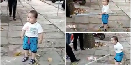 Watch this toddler defend his grandma from police with a heavy metal pipe