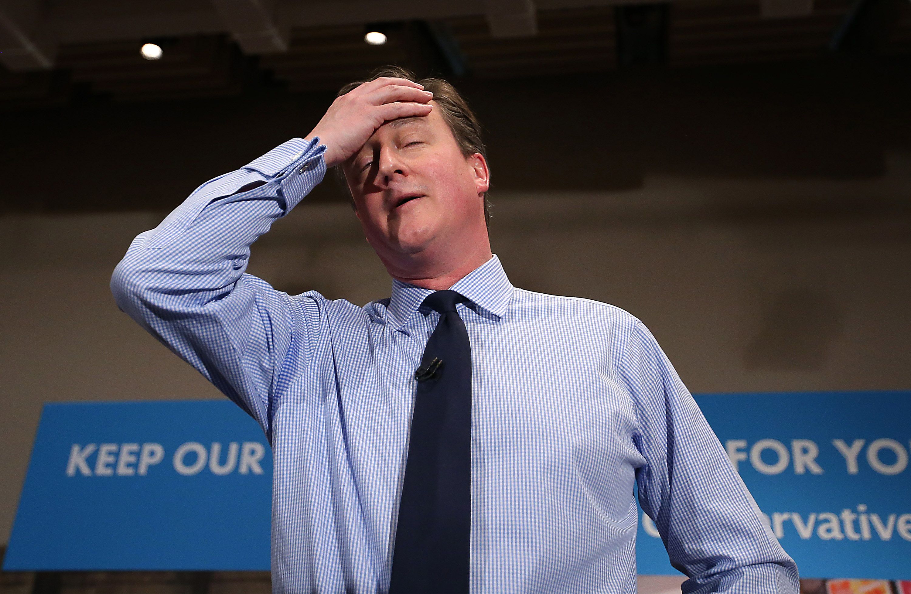 LONDON, ENGLAND - APRIL 27:  Prime Minister David Cameron wipes away some sweat as he speaks to business leaders on April 27, 2015 in London, England. Mr Cameron has started the fifth week of the general election campaign with a passionate speech in the heart of the City of London financial district.  (Photo by Peter Macdiarmid/Getty Images)