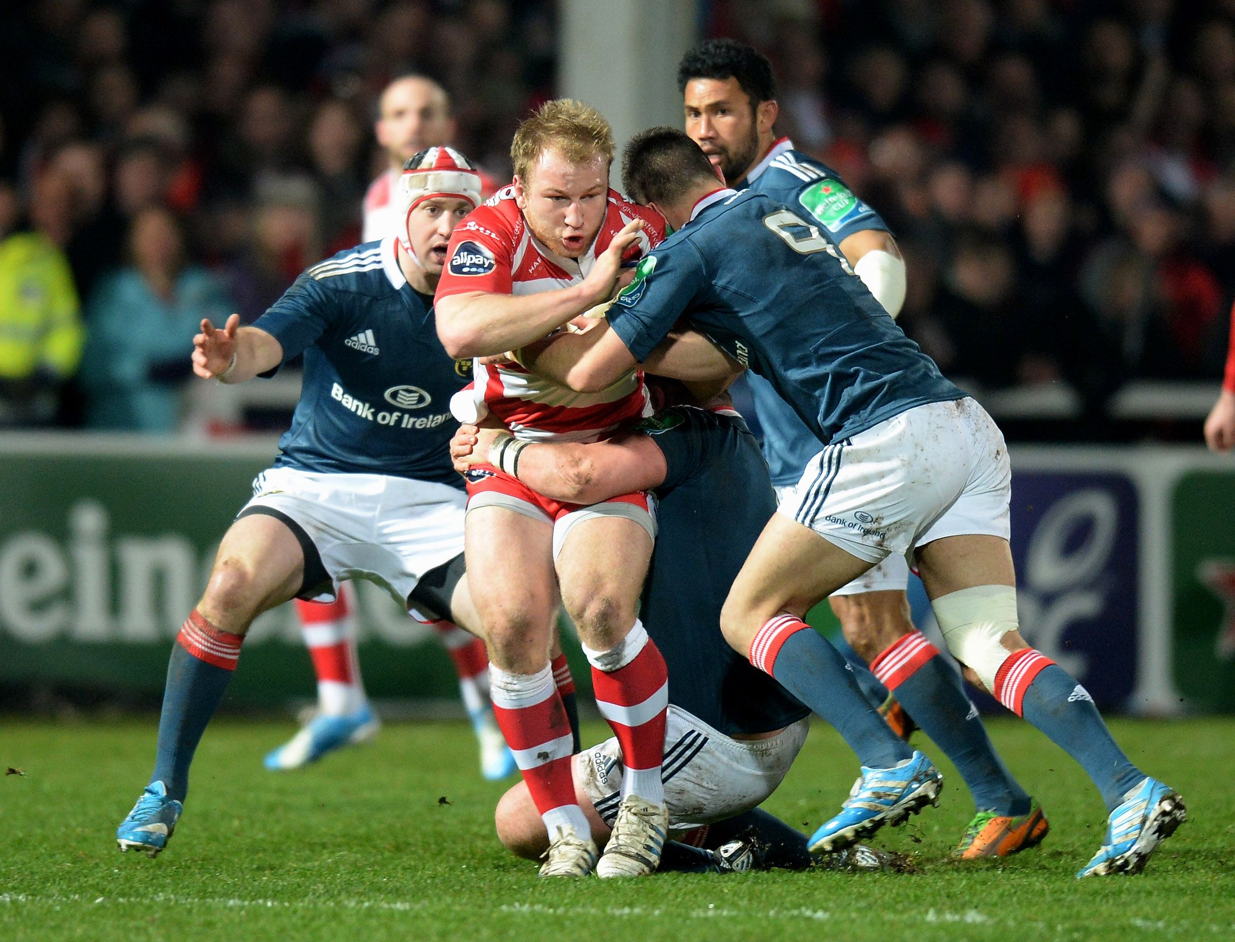 GLOUCESTER, ENGLAND - JANUARY 11: Matt Kvesic of Gloucester tackled by Conor Murray of Munster during the Heineken Cup Pool Six match between Gloucester and Munster at Kingsholm Stadium on January 11, 2014 in Gloucester, England. (Photo by Tony Marshall/Getty Images)