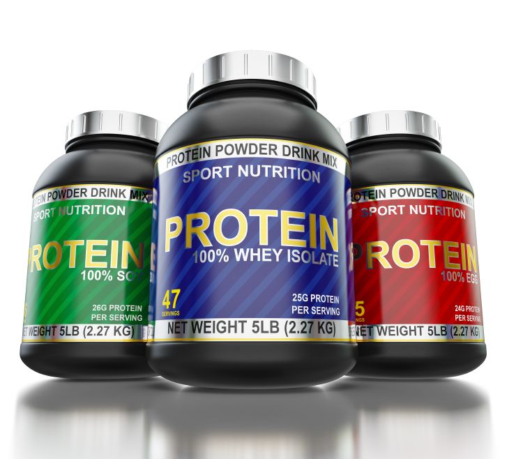 Sport nutrition and bodybuilding fitness supplements concept - whey isolate, soy and egg protein cans on white background with reflection, wide angle shot from low point of view