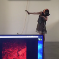 This woman freaking out during a virtual reality zombie game is seriously funny