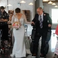 Paralysed father uses robotic suit to walk daughter down the aisle