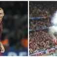 Russia fans let of flare despite warnings over fan conduct