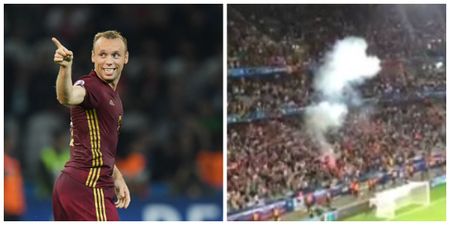Russia fans let of flare despite warnings over fan conduct