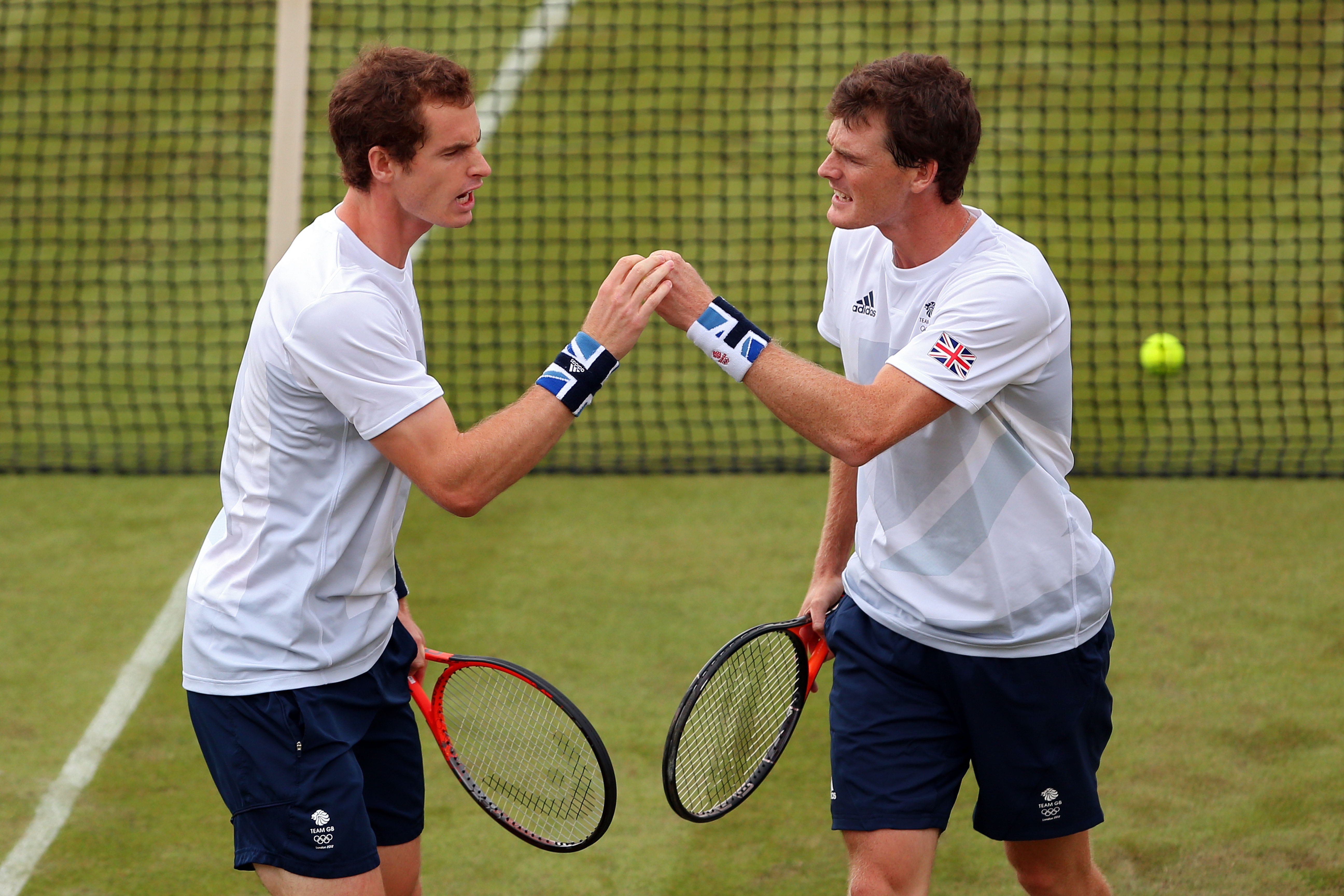 LONDON, ENGLAND - JULY 28: Andy Murray and Jamie Murray of Great Britain reacts after a point against Alexander Peya and Jurgen Melzer of Austria during their Men's Doubles Tennis match on Day 1 of the London 2012 Olympic Games at the All England Lawn Tennis and Croquet Club in Wimbledon on July 28, 2012 in London, England. (Photo by Clive Brunskill/Getty Images)