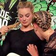 Cara Delevingne tries out her ‘nipple detector’ on Margot Robbie and we don’t know what to think