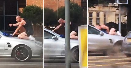 Astonishing footage of road rage driver punching and headbutting a moving vehicle