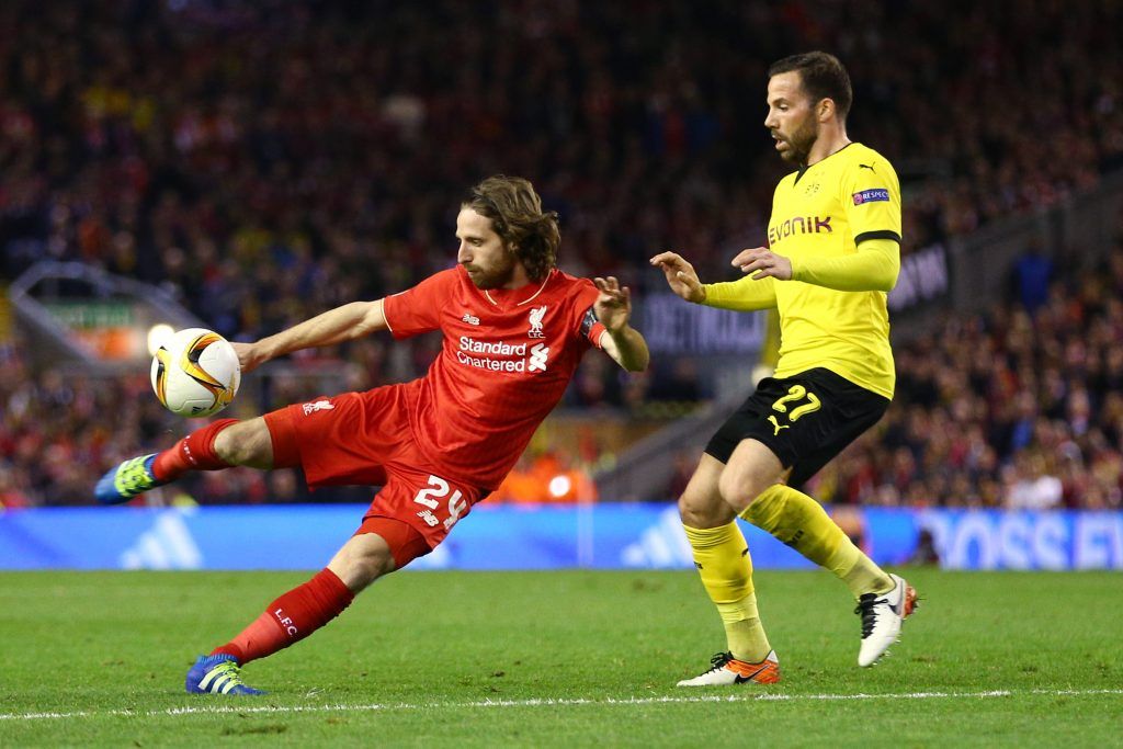 LIVERPOOL, ENGLAND - APRIL 14: Joe Allen of Liverpool shoots with Gonzalo Castro of Borussia Dortmund during the UEFA Europa League quarter final, second leg match between Liverpool and Borussia Dortmund at Anfield on April 14, 2016 in Liverpool, United Kingdom. (Photo by Clive Brunskill/Getty Images)