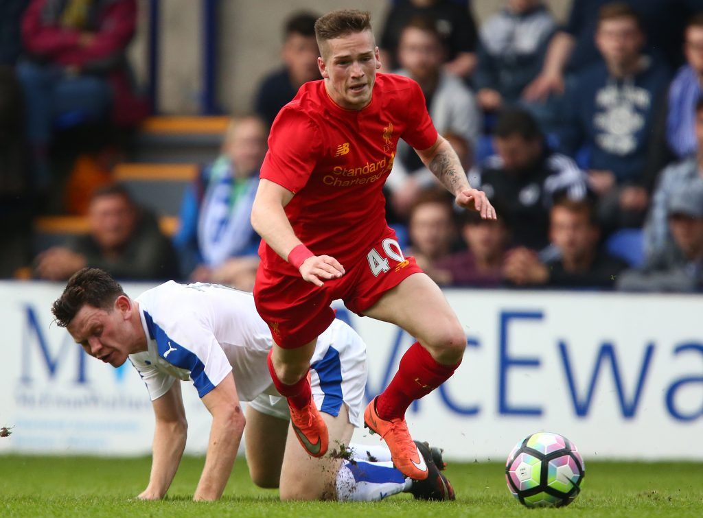 BIRKENHEAD, ENGLAND - JULY 08: Ryan Kent of Liverpool gets past Connor Jennings of Tranmere Rovers during the Pre-Season Friendly match between Tranmere Rovers and Liverpool at Prenton Park on July 8, 2016 in Birkenhead, England. (Photo by Dave Thompson/Getty Images)