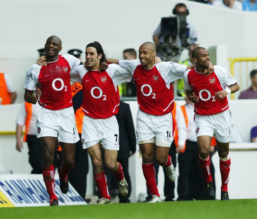 LONDON - APRIL 24: Patrick Viera,Robert Pires,Thierry Henry and Ashley Cole of Arsenal celebrate after the second goal during the FA Barclaycard Premiership match between Tottenham Hotspur and Arsenal at White Hart Lane on April 25, 2004 in London. (Photo by Shaun Botterill/Getty Images) *** Local Caption *** Patrick Viera;Robert Pires;Thierry Henry;Ashley Cole