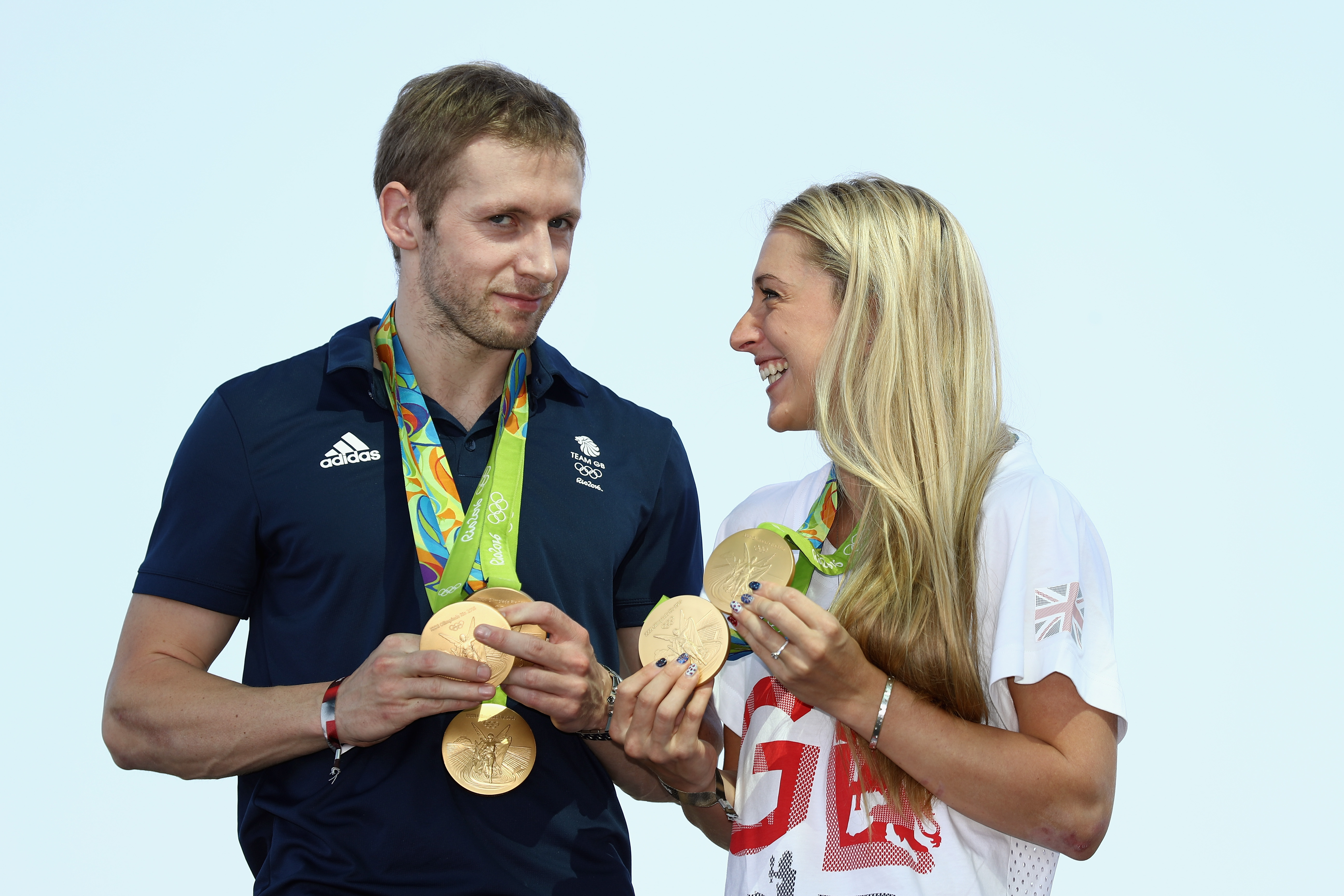 RIO DE JANEIRO, BRAZIL - AUGUST 17: Team GB cyclists Laura Trott and Jason Kenny pose with their gold medals at Adidas House on August 17, 2016 in Rio de Janeiro, Brazil. (Photo by Bryn Lennon/Getty Images)