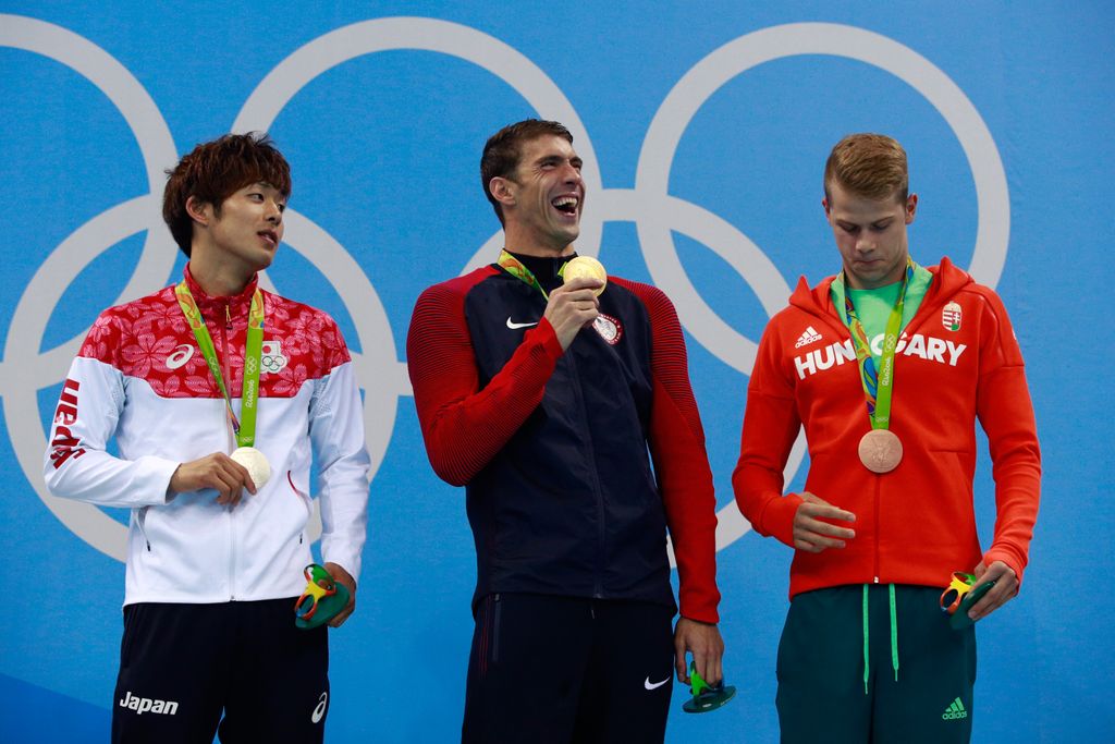 RIO DE JANEIRO, BRAZIL - AUGUST 09: (L-R) Silver medalist Masato Sakai of Japan, gold medalist Michael Phelps of the United States and bronze medalist Tamas Kenderesi of Hungary pose on the podium during the medal ceremony for the Men's 200m Butterfly Final on Day 4 of the Rio 2016 Olympic Games at the Olympic Aquatics Stadium on August 9, 2016 in Rio de Janeiro, Brazil. (Photo by Adam Pretty/Getty Images)