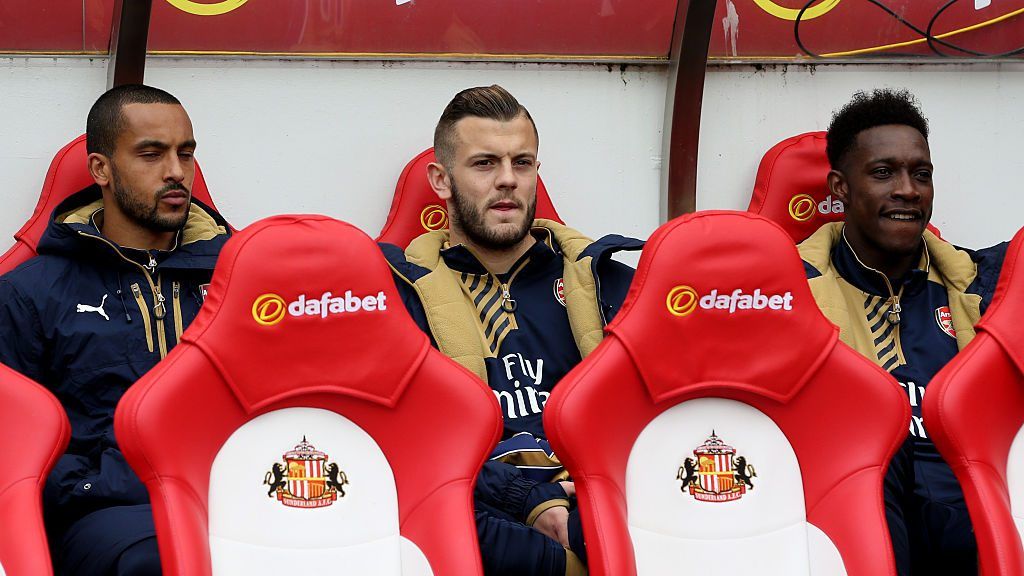 SUNDERLAND, ENGLAND - APRIL 24: (L-R) Substitutes Theo Walcott, Jack Wilshere and Danny Welbeck of Arsenal look on from the bench during the Barclays Premier League match between Sunderland and Arsenal at the Stadium of Light on April 24, 2016 in Sunderland, United Kingdom. (Photo by Jan Kruger/Getty Images)