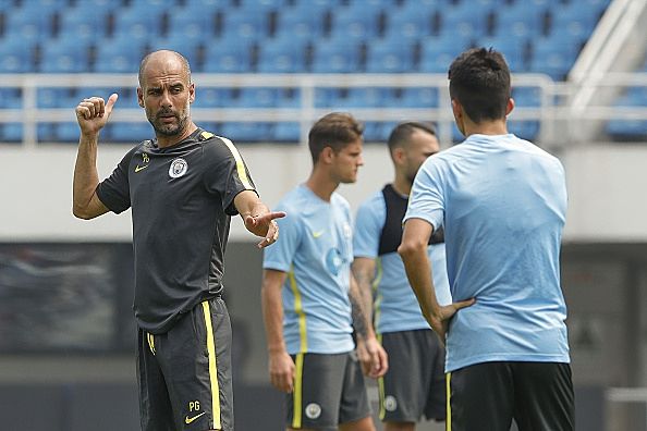 BEIJING, CHINA - JULY 24: Manchester City's manager Pep Guardiola gestures during the pre-game training ahead of the 2016 International Champions Cup match between Manchester City and Manchester United at Olympic Sports Center Stadium on July 24, 2016 in Beijing, China. (Photo by Lintao Zhang/Getty Images)
