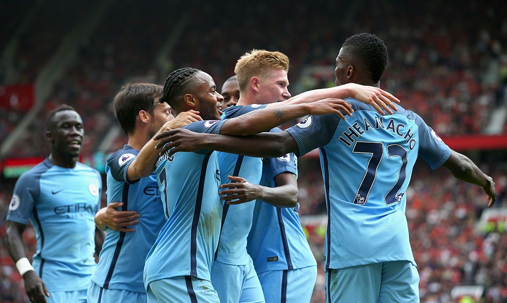 MANCHESTER, ENGLAND - SEPTEMBER 10: Kelechi Iheanacho of Manchester City (R) celebrates scoring his sides second goal with his Manchester City team mates during the Premier League match between Manchester United and Manchester City at Old Trafford on September 10, 2016 in Manchester, England. (Photo by Alex Livesey/Getty Images)
