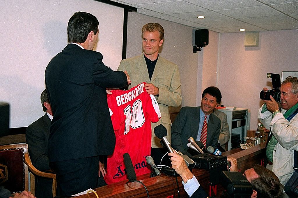 Aug 1995: Dennis Bergkamp shakes manager Bruce Rioch by the hand after signing for Arsenal at Highbury in London. Mandatory Credit: Allsport UK /Allsport