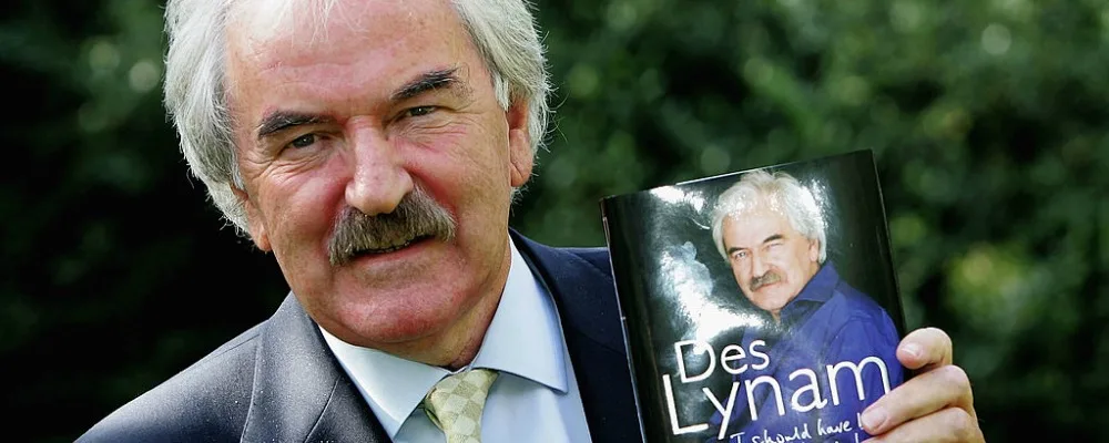 LONDON - OCTOBER 03: Des Lynam poses with his book before attending the book launch for today's publication of Des Lynams autobiography I Should Have Been At Work at the Carlton Tower Hotel on October 3, 3005 in London, England. (Photo by Chris Jackson/Getty Images) *** Local Caption *** Des Lynh