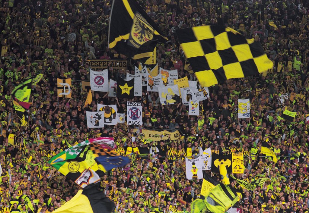 8 Sep 2001: Borussia Dortmund fans cheer their team on during the German Bundesliga match between Borussia Dortmund and Bayern Munich played at the Westfalenstadion, Dortmund, Germany. Mandatory Credit: Stuart Franklin /Allsport