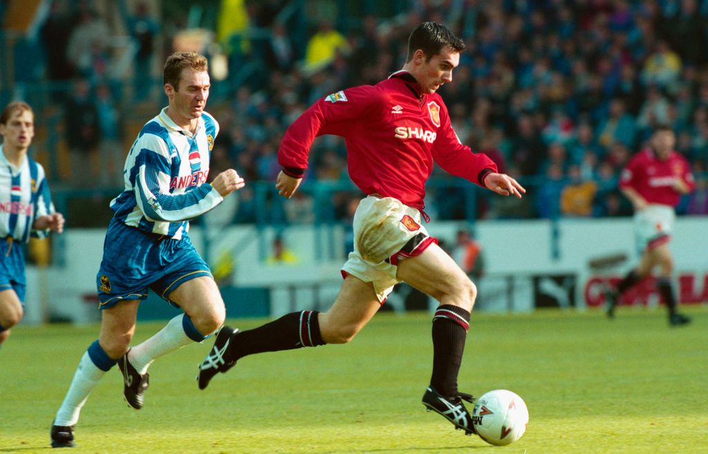 SHEFFIELD, UNITED KINGDOM - OCTOBER 08: Manchester United winger Keith Gillespie races away from John Sheridan of Sheffield Wednesday during an FA Premiership match between Sheffield Wednesday and Manchester United at Hillsbrough on October 8, 1994 in Sheffield, England.  (Photo by Graham Chadwick/Allsport/Getty Images)