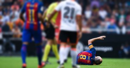 Andres Iniesta leaves pitch in tears after sickening injury to his right knee