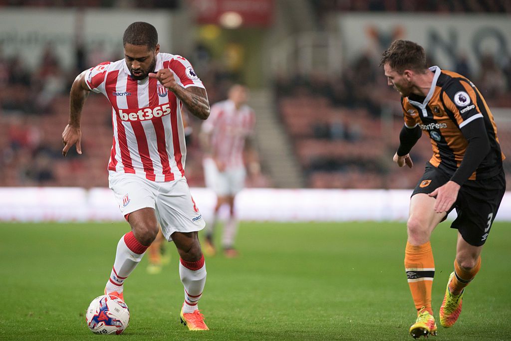 STOKE ON TRENT, ENGLAND - SEPTEMBER 21: Glen Johnson of Stoke City and Andrew Robertson of Hull City in action during the EFL Cup Third Round match between Stoke City and Hull City at the Britannia Stadium on September 21, 2016 in Stoke on Trent, England. (Photo by Nathan Stirk/Getty Images)