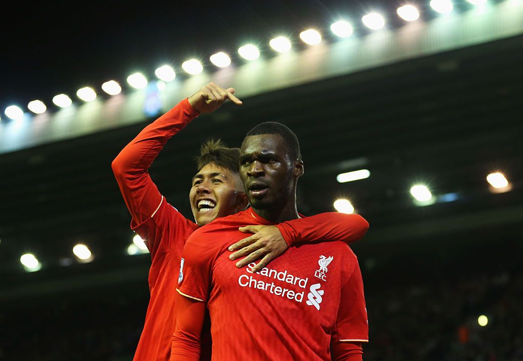 LIVERPOOL, ENGLAND - OCTOBER 25: Christian Benteke (R) of Liverpool celebrates scoring his team's first goal with his team mate Roberto Firmino (L) during the Barclays Premier League match between Liverpool and Southampton at Anfield on October 25, 2015 in Liverpool, England. (Photo by Jan Kruger/Getty Images)