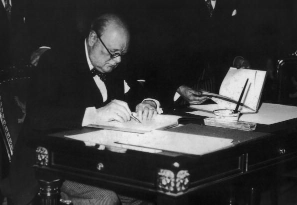 British statesman Winston Churchill (1874 - 1965) puts pen to paper, 1936. (Photo by Keystone/Hulton Archive/Getty Images)