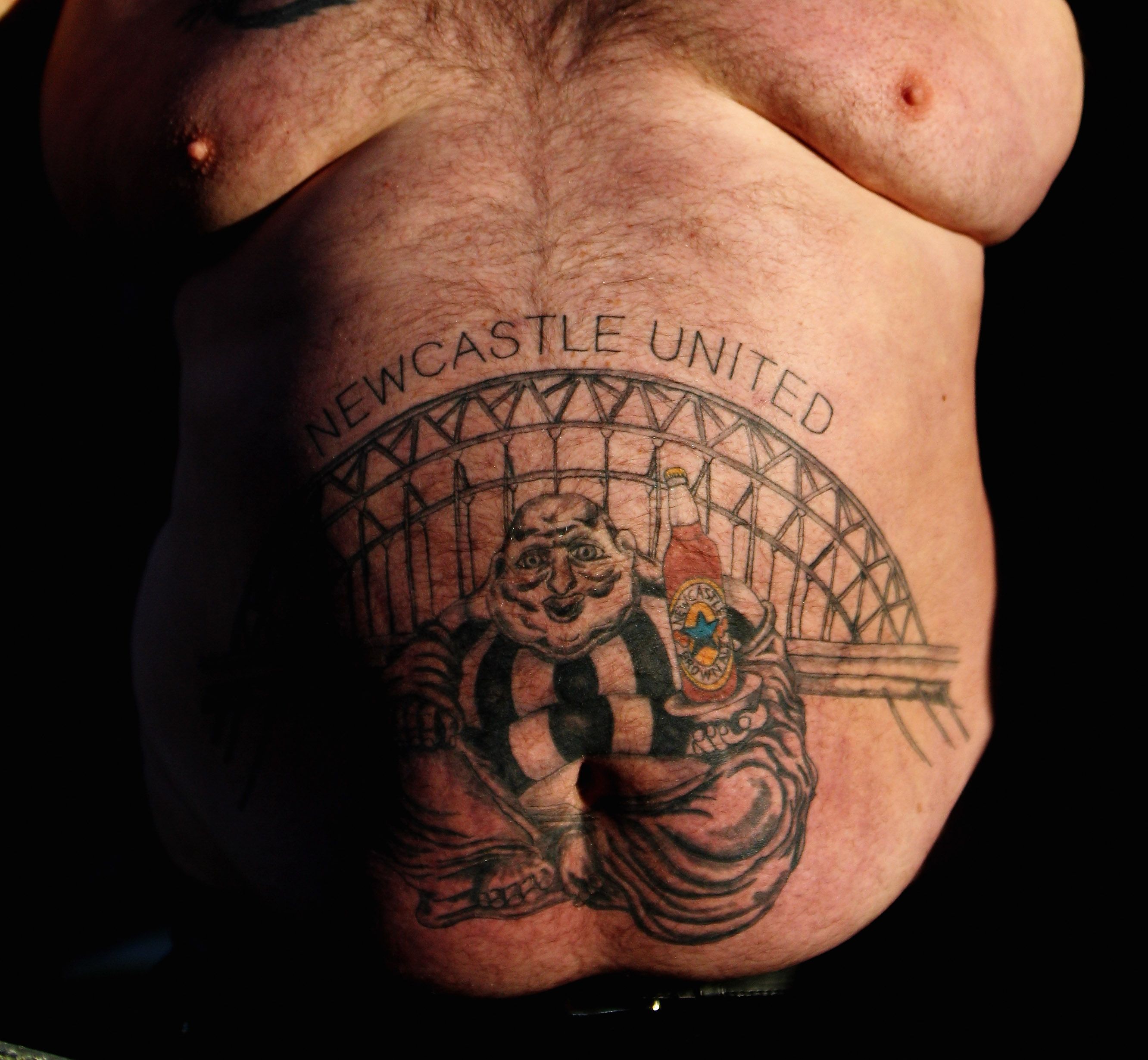 BLACKBURN, ENGLAND - FEBRUARY 12: A Newcastle fan shows his tattoo during the Barclays Premier League match between Blackburn Rovers and Newcastle United at Ewood Park on February 12, 2011 in Blackburn, England. (Photo by Dean Mouhtaropoulos/Getty Images)