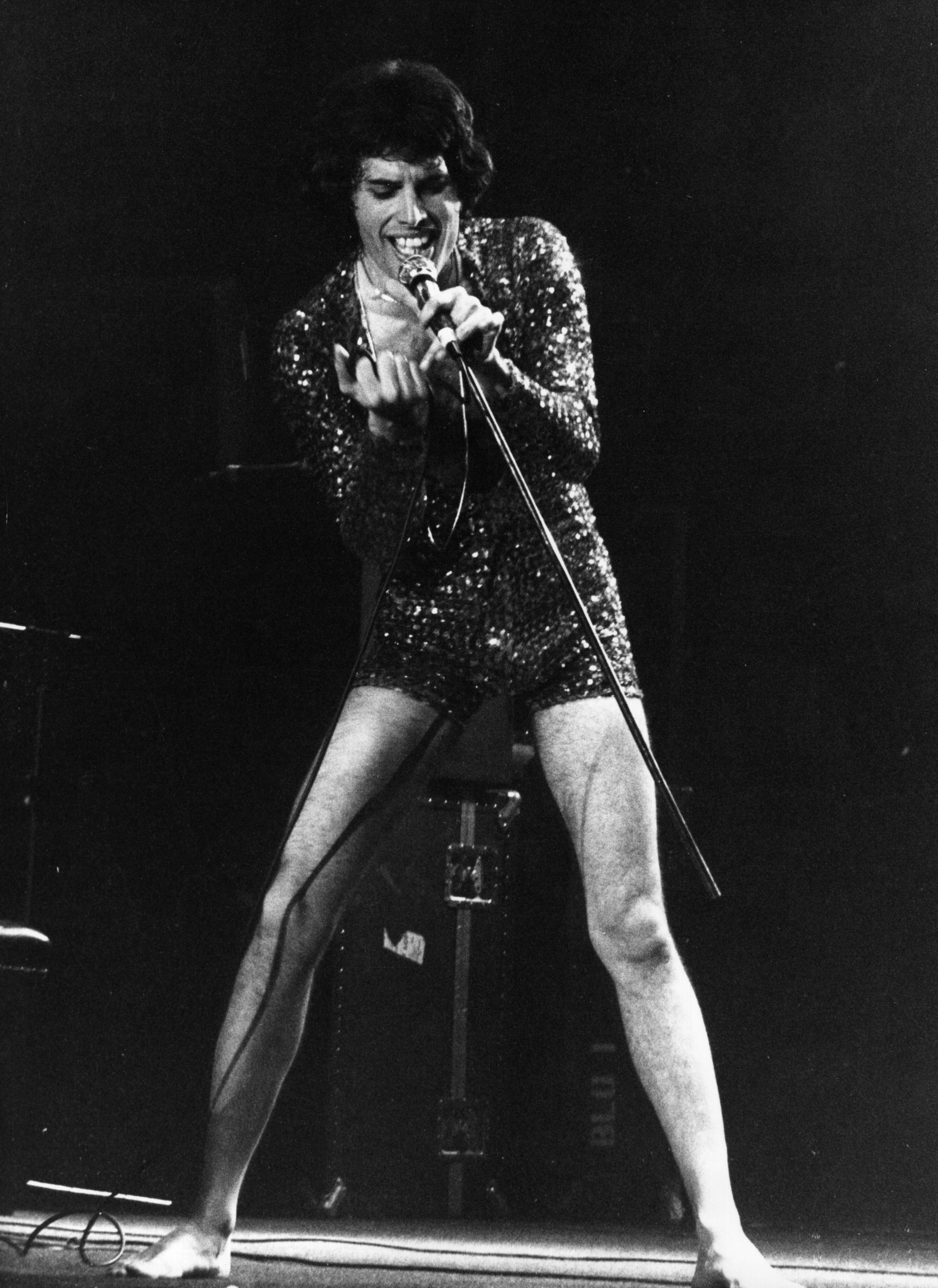 May 1978: Freddie Mercury (Frederick Bulsara, 1946 - 1991), singer with popular British rock group Queen, on stage with the band at the first of three sell-out nights at London's Wembley Arena, May 1972. (Photo by Gary Merrin/Keystone/Getty Images)