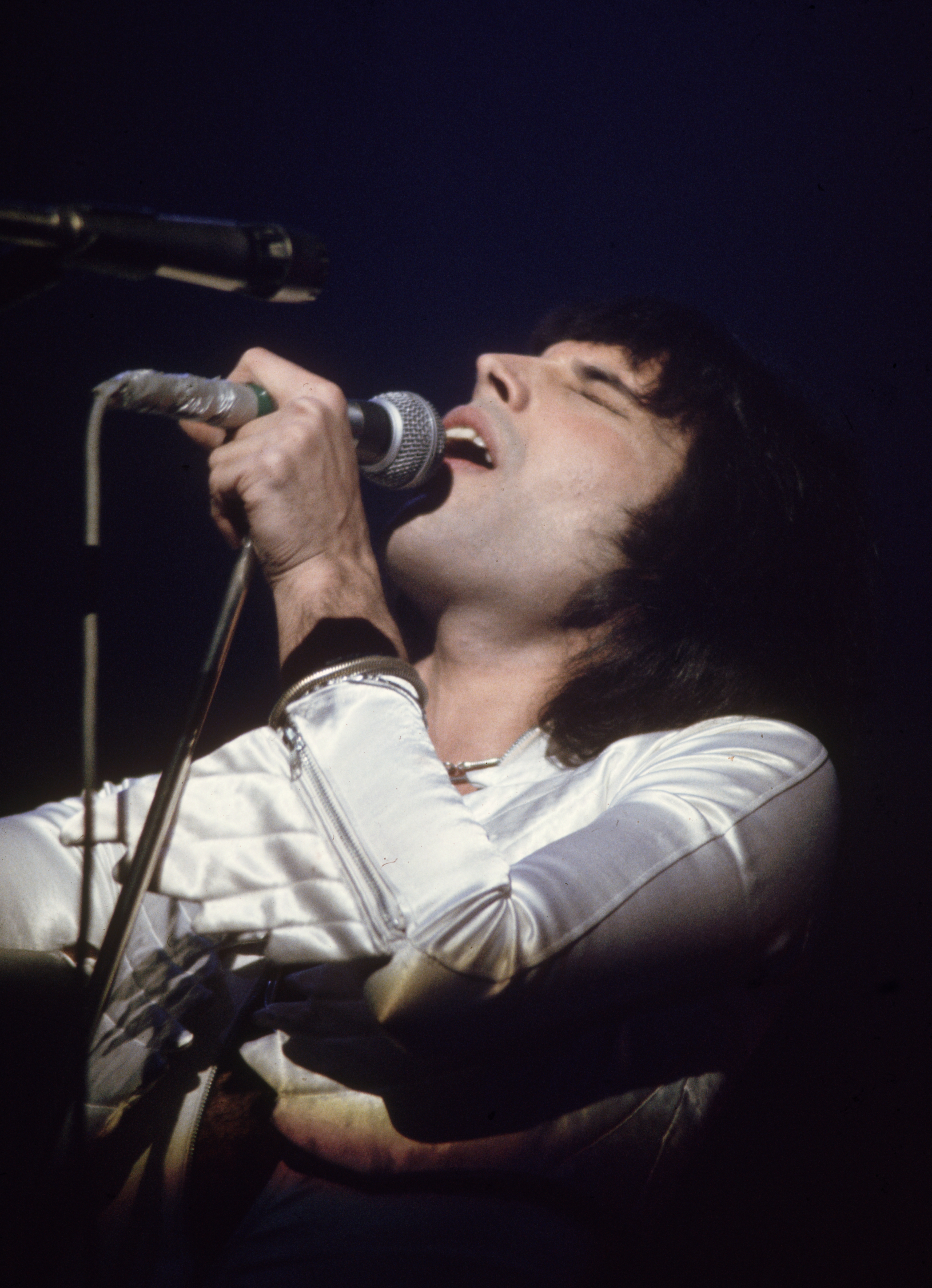 circa 1975: Freddie Mercury (1946 - 1991), lead singer of 70s hard rock quartet Queen, in concert during the group's British tour. (Photo by Keystone/Getty Images)