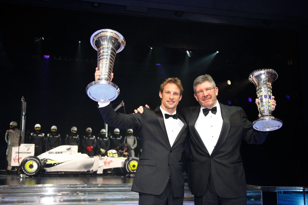MONACO - DECEMBER 11: In this handout image provided by FIA, FIA Formula One driver Jenson Button (L) of Great Britain and Brawn Team Principal Ross Brawn pose with the respective FIA World Driver's Championship and FIA Constructors Championship trophies during the 2009 FIA Gala Prize Giving Ceremony held at the Salle des Etoiles Sporting Club on December 11, 2009 in Monte-Carlo, Monaco. (Photo by FIA via Getty Images)