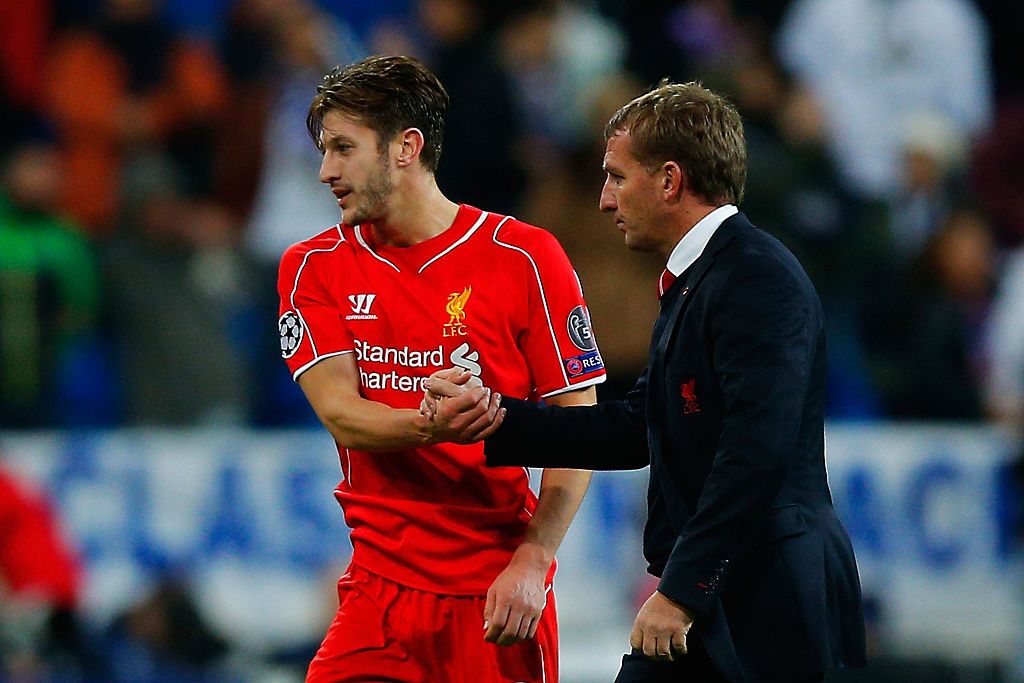 MADRID, SPAIN - NOVEMBER 04: Adam Lallana (L) of Liverpool FC shakes hands with his head coach Brendan Rodgers (R) after the UEFA Champions League Group B match between Real Madrid CF and Liverpool FC at Estadio Santiago Bernabeu on November 4, 2014 in Madrid, Spain. (Photo by Gonzalo Arroyo Moreno/Getty Images)