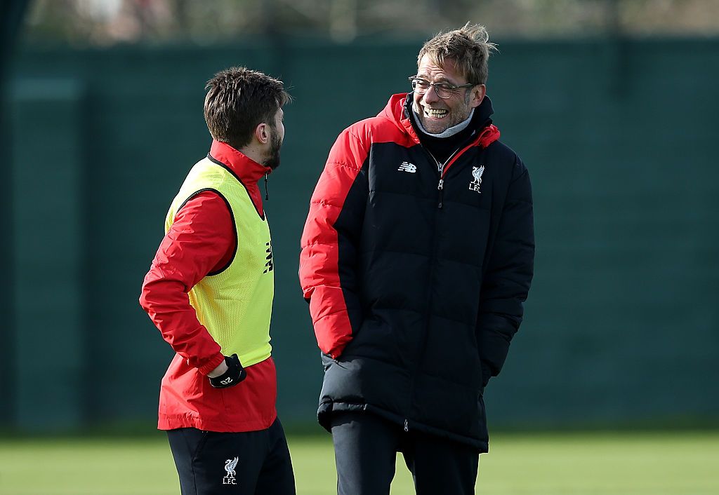 LIVERPOOL, ENGLAND - FEBRUARY 26: Liverpool manager Jurgen Klopp shares a joke with Adam Lallana during a training session ahead of their Capital One Cup final match against Manchester City at Melwood Training Ground on February 26, 2016 in Liverpool, United Kingdom. (Photo by Jan Kruger/Getty Images)