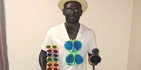 Footballer apologises for painting himself black for Christmas party