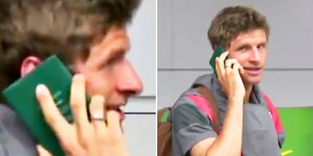 Thomas Müller avoids questions from the press by using his passport as a phone