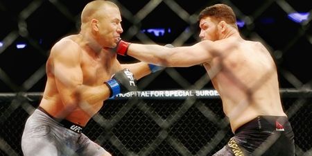 Michael Bisping choked unconscious as Georges St-Pierre claims middleweight gold